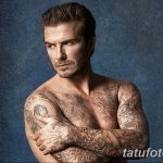 Фото Дэвида Бекхэма с татуировками на руках и теле, демонстрирующее его стиль и индивидуальность.