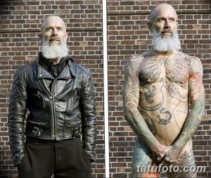 Фотография мужчины с длинной бородой и татуировками на теле, демонстрирующая его индивидуальность и бунтарский дух.