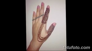 Фото тату хной на руке, цепочки, узоры, коричневые тона, восточный стиль, украшение для праздника или повседневной жизни.