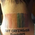 Фото тату: Штрих-код и надпись "NOT CRYING ON SUNDAYS" на затылке. Черно-белая татуировка, необычный дизайн.