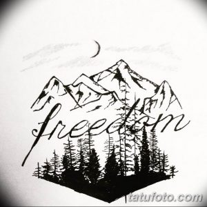 Фото эскиза татуировки с изображением гор, леса и надписи 'freedom'. Идея для тату на предплечье или спине.