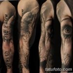 Фотография татуировки в виде рукава на руке с изображением ворона, глаза и ветвей деревьев, выполненного в реалистичном стиле.
