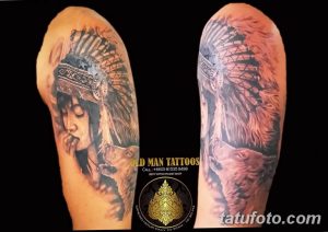 Фото тату индейского вождя в головном уборе с орлом на руке. Детализированный рисунок выполнен в реалистичном стиле с использованием ярких цветов и теней.