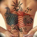 Фото тату на спине с изображением американского флага, статуи Свободы, орла и портретов президентов. Детализированный рисунок татуировки, символизирующий любовь к США.