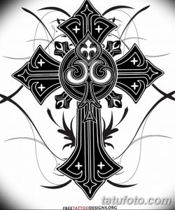 Фото тату готического креста в стиле Blackwork. Сложный и детализированный рисунок с острыми углами и переплетениями. Идеально для поклонников готической культуры.