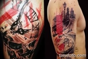 Фото тату на руке с изображением абстрактного городского пейзажа, выполненного в технике брызг краски. Изображение зданий, часов и фонарей.