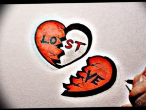 Фотография эскиза татуировки разбитого сердца с надписью 'LOST'. Красные и черные цвета символизируют боль и печаль.