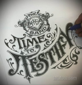 Фотография эскиза татуировки с надписью 'The First Band Time to Destiny', выполненной в винтажном стиле с декоративными элементами.