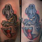Фото тату на руке с изображением персонажей из игры Mario – Bowser и Boo. Яркий рисунок татуировки в мультяшном стиле.