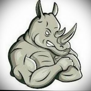 Забавное черно-белое фото тату носорога с мускулистым телом и поднятыми руками, словно готовящегося к боксерскому поединку.
