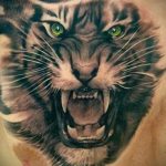 Фото рисунка тату оскал тигра 05.02.2020 №004 -tiger grin tattoo- tatufoto.com