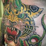 Фото рисунка тату оскал тигра 05.02.2020 №061 -tiger grin tattoo- tatufoto.com