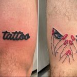 Фото тату на ноге с надписью 'a tattoo' и изображением женских рук с красным маникюром. Стиль - минимализм, цвета - черный и красный.