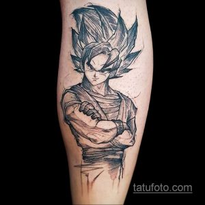 Фото татуировки Гоку Блэка из Dragon Ball Super на икре. Черно-белый рисунок с использованием штриховки и брызг.
