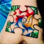 Фото татуировки пазл ко дню аутистов 02.04.2020 №061 -autism puzzle tattoo- tatufoto.com