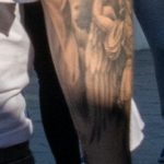 Тату на правой руке парня с римскими цифрами и ангелом с мечом - Уличная татуировка (Street tattoo) № 03 – 11.05.2020 для tatufoto.com 3