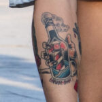 Татуировка маяк в бутылке на ноге парня – Уличная татуировка (street tattoo) № 06 – 18.06.2020 – tatufoto.com 2
