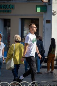 Фото тату на плече: красочный рисунок дракона в восточном стиле. Детализированный рисунок татуировки с использованием зеленых и черных оттенков.