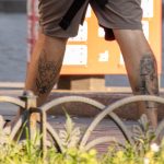 Тату египетская кошка с жуком и клоун внизу ноги парня --Уличная тату-street tattoo-21.09.2020-tatufoto.com 2