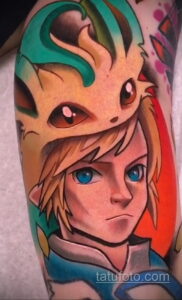 Фото тату на руке с изображением Линк и другого персонажа из игры The Legend of Zelda, выполненное в ярких цветах.