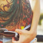 Фото женской тату на животе 16.11.2020 №011 -Female tattoo on her stomach- tatufoto.com