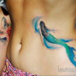 Фото женской тату на животе 16.11.2020 №062 -Female tattoo on her stomach- tatufoto.com