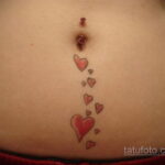 Фото женской тату на животе 16.11.2020 №124 -Female tattoo on her stomach- tatufoto.com
