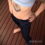 Фото женской тату на животе 16.11.2020 №219 -Female tattoo on her stomach- tatufoto.com