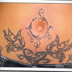 Фото женской тату на животе 16.11.2020 №242 -Female tattoo on her stomach- tatufoto.com