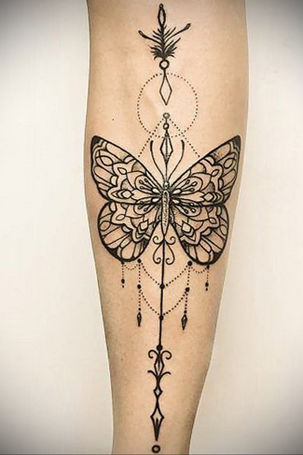 Mandala tattoo with butterfly image