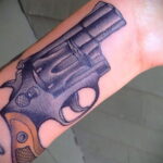 тату револьвер на руке 16.02.2021 №0017 - revolver tattoo on arm - tatufoto.com