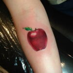 Пример женской тату с яблоком 03.03.2021 №016 - girl with apple tattoo - tatufoto.com