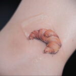 Фото татуировки круассан 05.06.2021 №049 - croissant tattoo - tatufoto.com