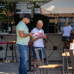 Тату череп, кастет, монстр и портрет девушки на руках парня - Уличная тату (street tattoo) № 14–210821 1