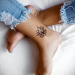 Фото тату лотос на ноге 07.08.2021 №026 - lotus tattoo on her leg - tatufoto.com