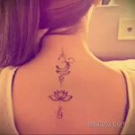 Фото тату лотос на спине 07.08.2021 №058 - lotus tattoo on back - tatufoto.com
