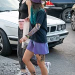 Молодая девушка в короткой юбке и тату фламинго на ноге 9 - Уличная тату (street tattoo) № 16– tatufoto.com 28082021№0248