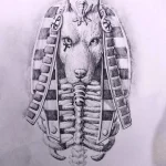 Фотография черно-белого эскиза татуировки Анубиса, выполненного карандашом. Детализированный рисунок с изображением головы бога.