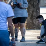 Фотография татуировки на ноге женщины, изображающей детализированный рисунок в стиле реализм. Видны сложные узоры и тени, создающие объемный эффект.