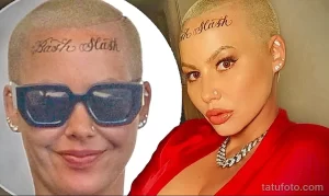 Фото тату: Amber Rose с татуировкой "Slash Slash" на лбу. Иллюстрация для поиска идей тату в необычных местах.