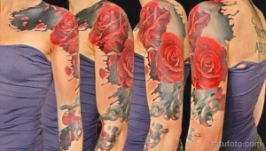 Фото тату: большой рукав из красных роз, выполненный в реалистичном стиле, с добавлением серых теней и листьев.
