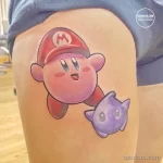 Фото тату: Яркая и красочная татуировка с изображением персонажей Nintendo – Kirby и Waddle Dee. Идеальный выбор для поклонников видеоигр.