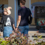 Фотография мужской татуировки на руке, изображающей птиц и символы. Видны детали рисунка и цветовая гамма.