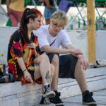 молодая девушка с татуировкой сюжетом из японского аниме на ноге00 - Уличная тату 22062022 №208 - tatufoto.com