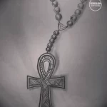 Эскиз татуировки, сочетающий в себе древнеегипетский символ Анкх и христианский крест, дополненный бусами.