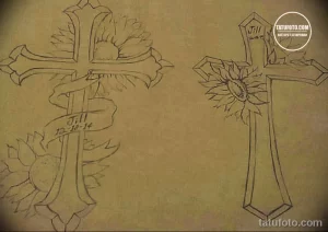 Эскиз татуировки, изображающий крест, украшенный подсолнухом и лентой с надписью. Нежный и символичный рисунок в черно-серых тонах.