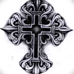Фото татуировки креста, выполненного в стиле blackwork. Плотное заполнение черным цветом создает эффектный и загадочный рисунок. Идеально для любителей темных тату.