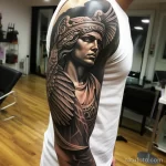 A man with a photorealistic sleeve tattoo of the Gre ed de f e adae _1 271123 tatufoto.com