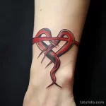 A tattoo of hands forming a heart around the red rib fdba ab bd ffe _1 231123 tatufoto.com