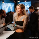 A woman with a full sleeve tattoo engaging in a Link bed e a dcf 171123 tatufoto.com